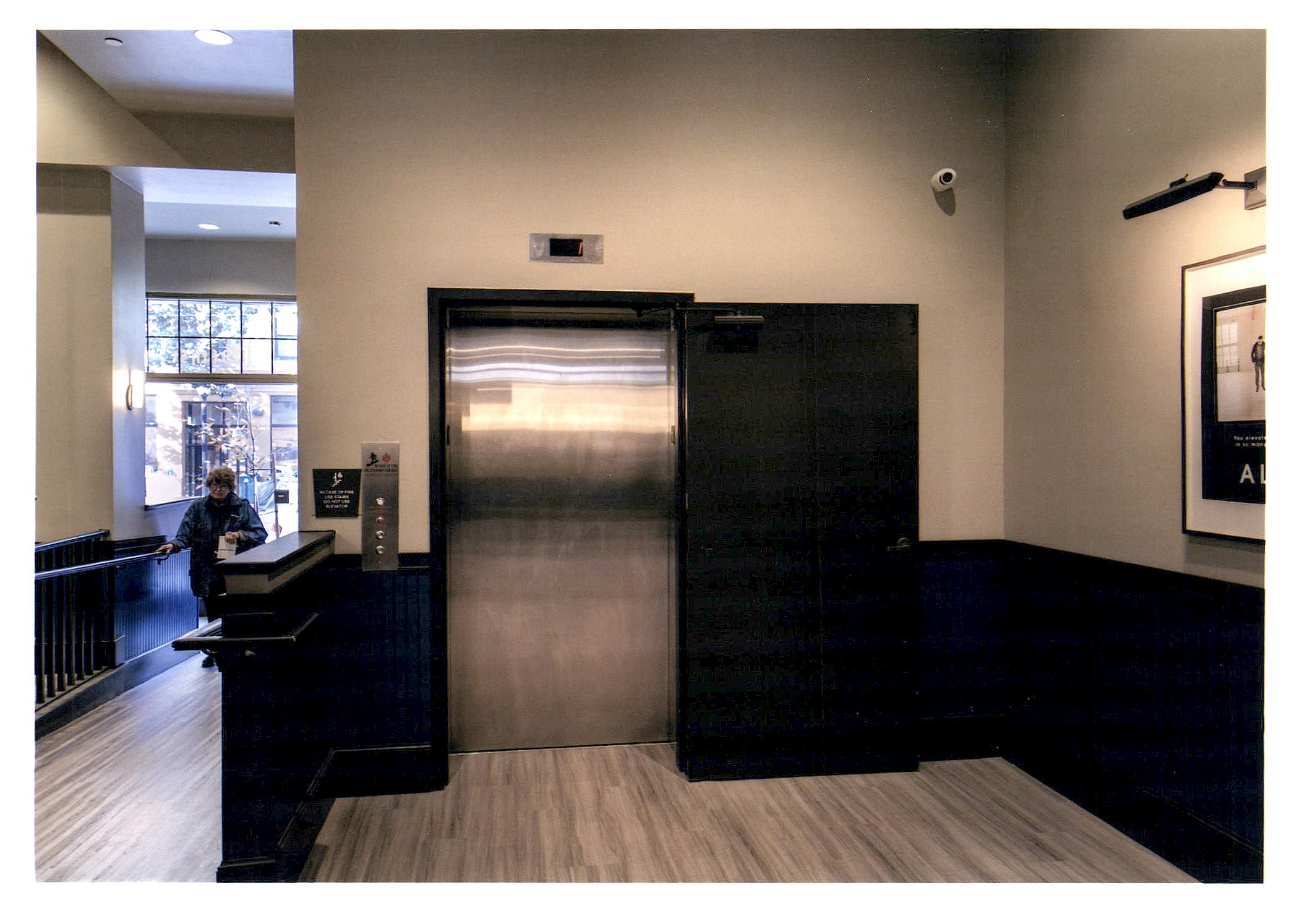 After: interior view of new elevator lobby looking back toward lobby entrance.